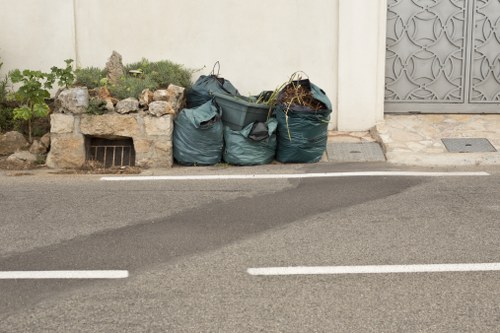 Builders removing waste from a construction area