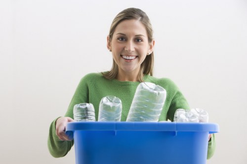 Team loading commercial bins during rubbish collection